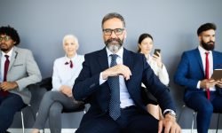 Group of business people with leader at front Group of business people with senior leader at front